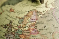 Detailed close-up image of a globe focusing on Northern Europe, featuring country labels and borders.